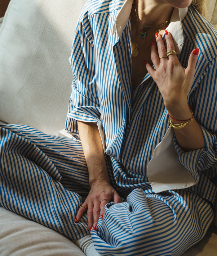 TENCEL™ Edit Blue Stripe Lounge Shirt worn as a set, model seated.