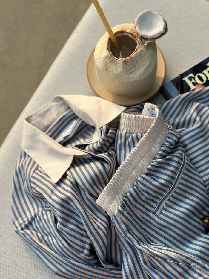 TENCEL™ Edit Blue Stripe Lounge Shorts laid flat alongside matching shirt.