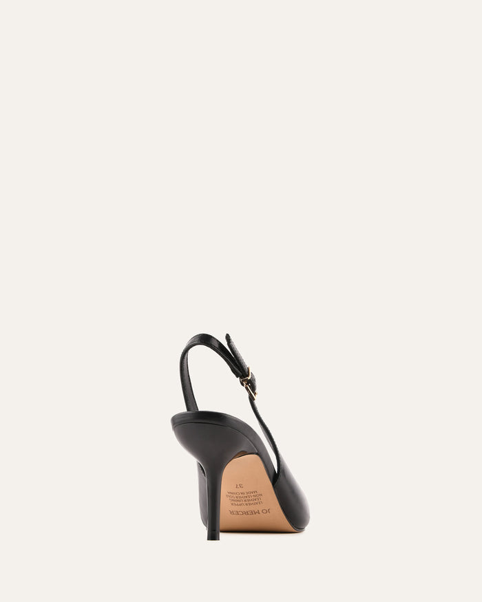 Black high-heeled shoe with a brown sole on a white background