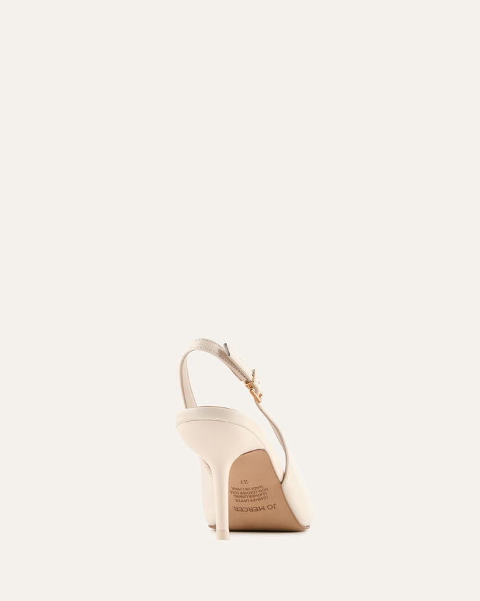 Beige high-heeled sandal on a light beige background