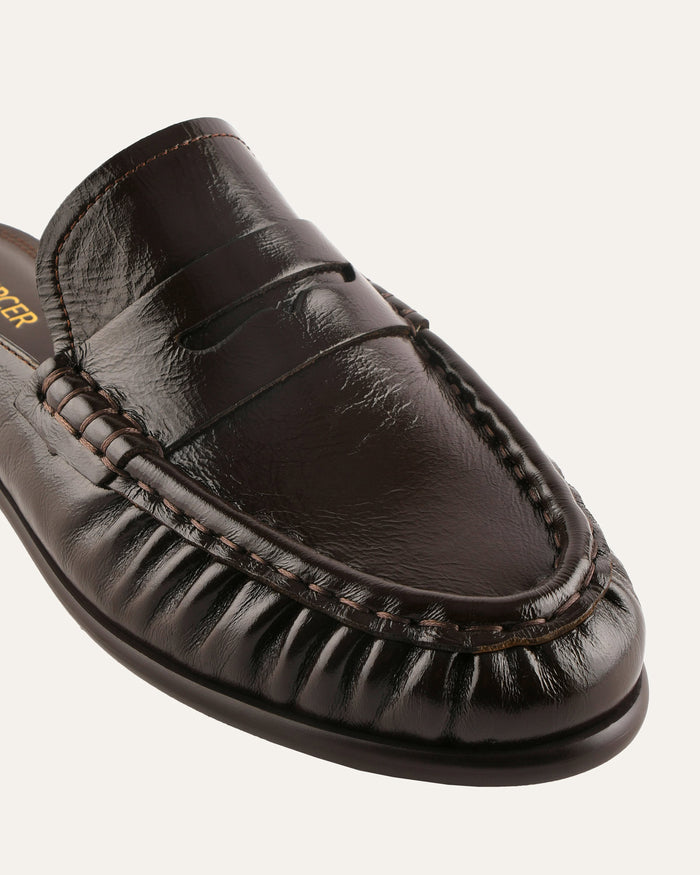 Brown leather loafer shoe on a white background