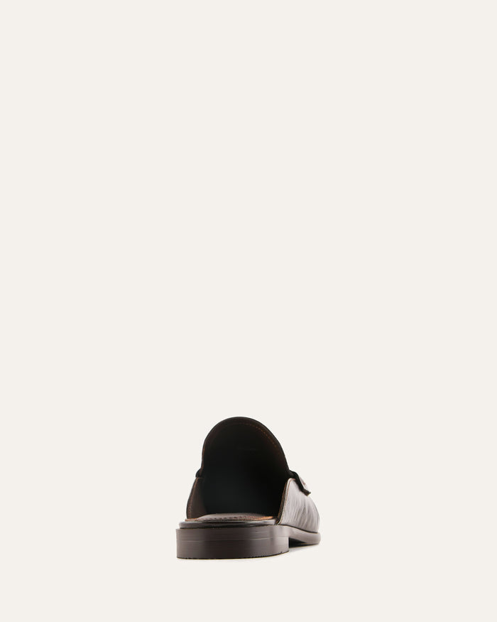 Black loafer shoe on a white background