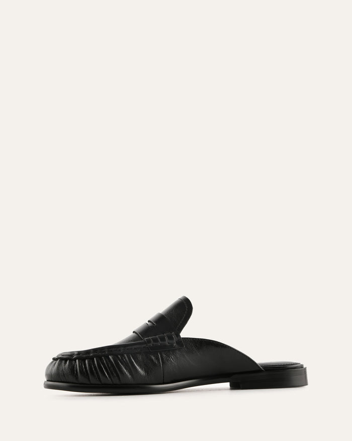 Black loafer shoe on a white background