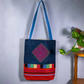Vindigo shoulder bag indigo hemp pink spiral patch full front hanging view