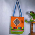 Vindigo shoulder bag orange hemp spiral patch full front hanging view
