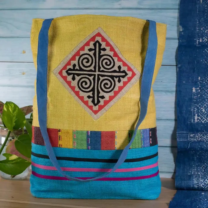 Vindigo tote bag yellow hemp with black spiral embroidery front view