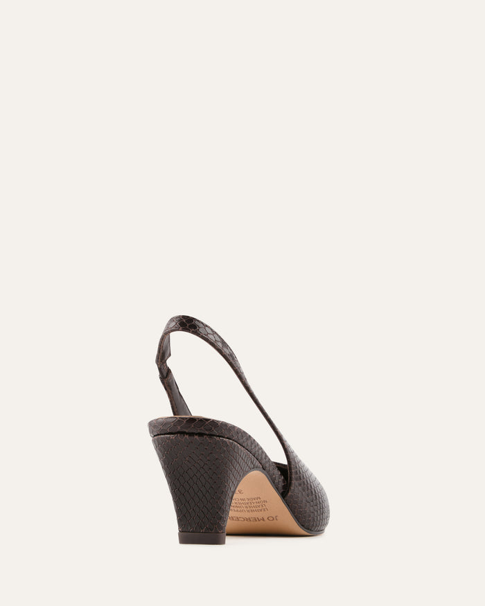 Brown wedge sandal on a white background