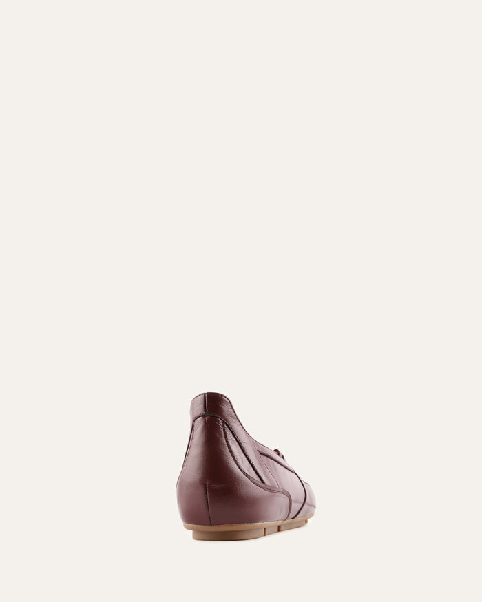 Brown leather shoe on a white background