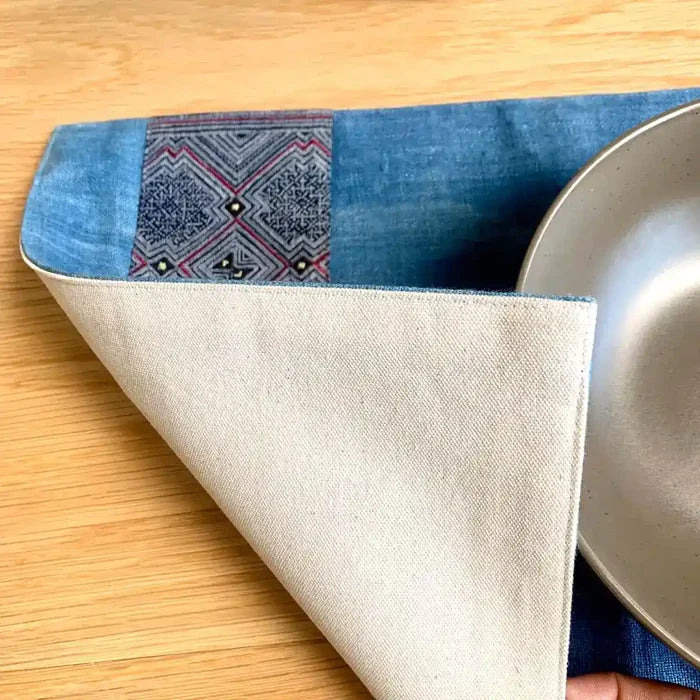 Vindigo placemat blue embroidered geometry fabric close detail
