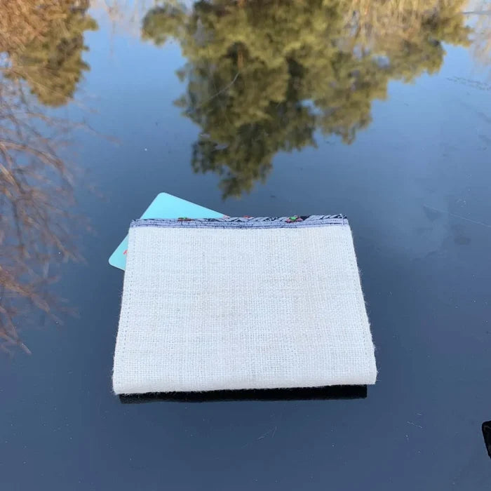 Vindigo wallet back view showing beige hemp fabric
