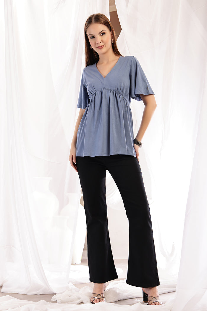 Back view of M Blue Top; full coverage ensures modesty.