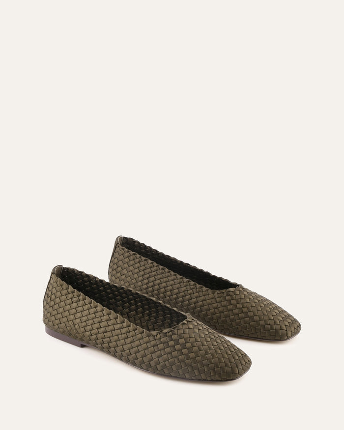 Pair of woven shoes on a white background