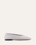 White running shoe with leopard print sole on a white background