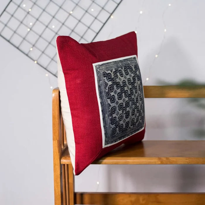 Vindigo red cushion cover side view showing handmade batik embroidery patch