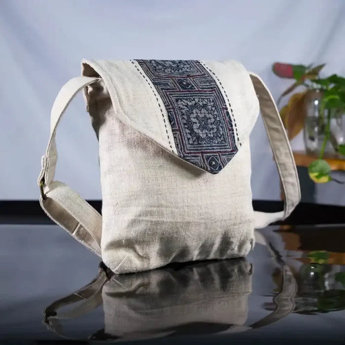 Pair of handmade hemp handbags with bamboo handles and unique batik fabric patches