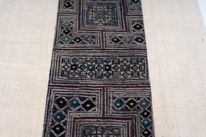 Decorative indigo embroidered strip from handmade hemp cushion cover