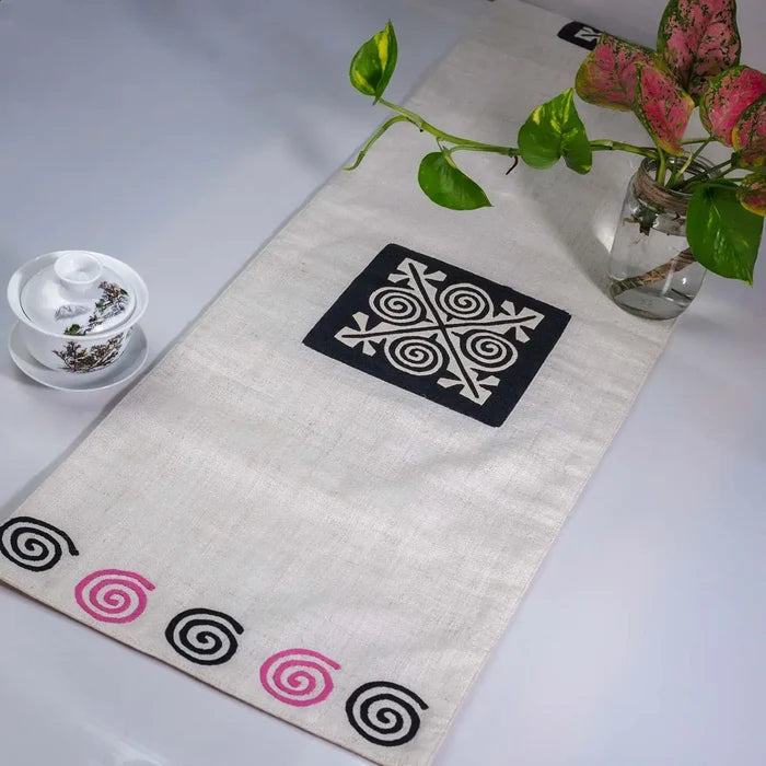 Vindigo beige hemp table runner side angle emphasizing artisan hand-stitching and texture