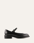 Black leather shoe with a strap on a white background