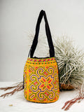 Yellow and blue embroidery shoulder bag with string to close