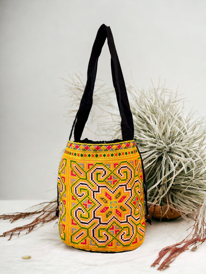 Yellow and blue embroidery shoulder bag with string to close