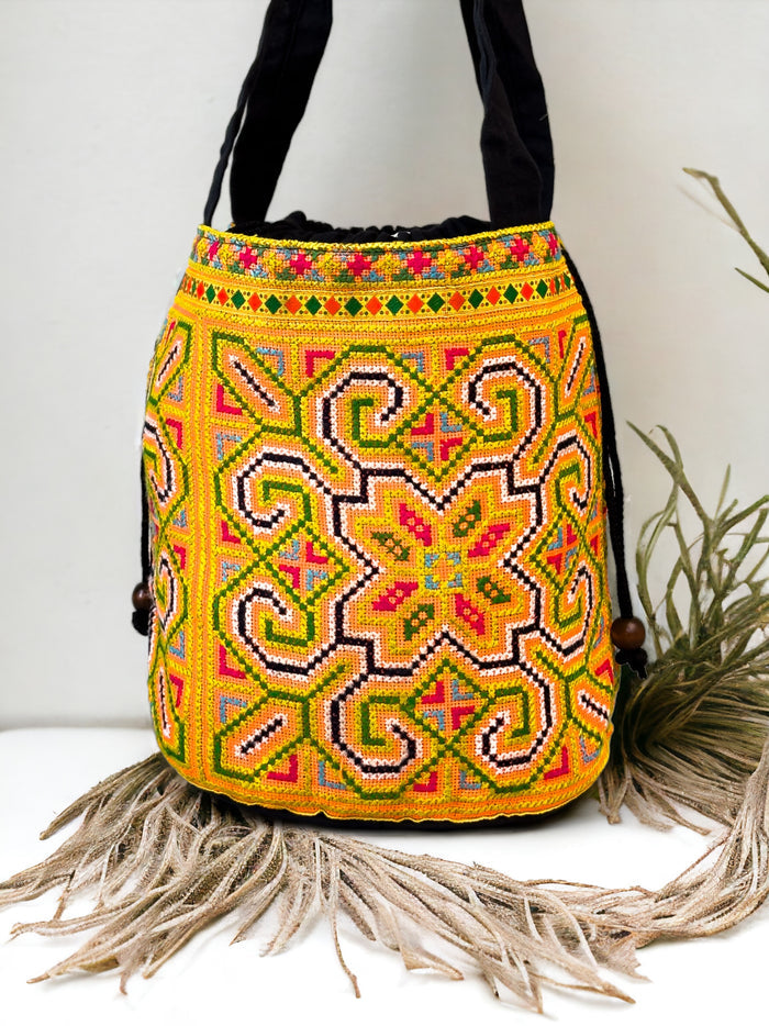 Yellow and blue embroidery shoulder bag with string to close